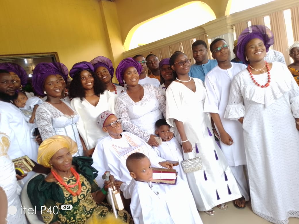 Celebrant with sister Mrs Ifakor, publisher ISOKO market day calendar and his grandchildren.