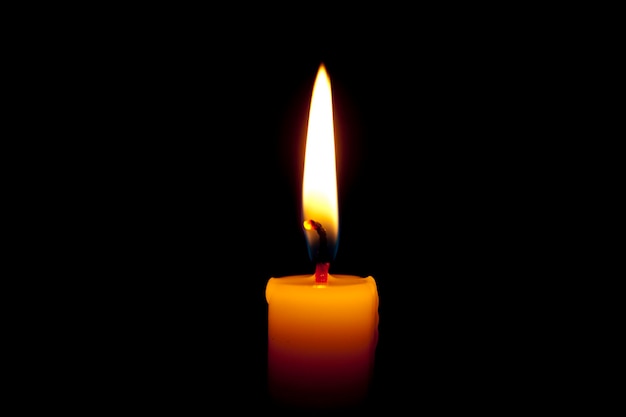 burning-candle-isolated-black-background_316889-811